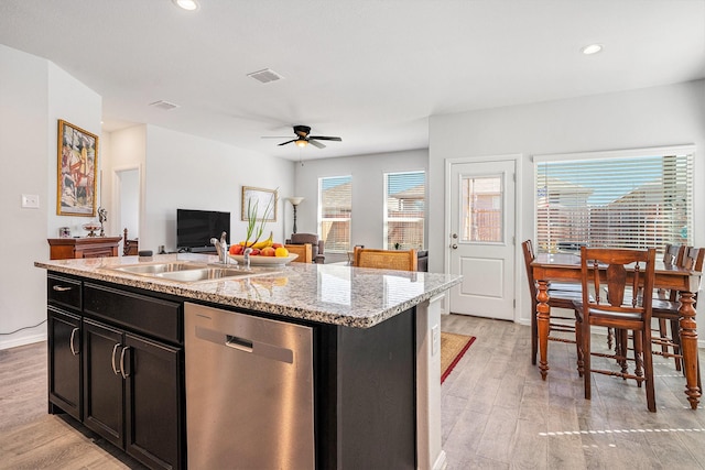 kitchen with ceiling fan, a sink, visible vents, stainless steel dishwasher, and light wood-type flooring