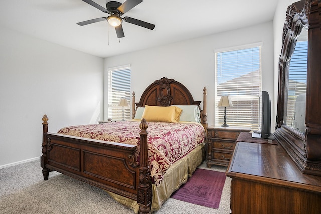 bedroom featuring carpet floors, baseboards, and a ceiling fan