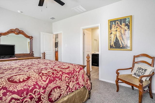 bedroom featuring carpet flooring, ensuite bath, visible vents, and baseboards