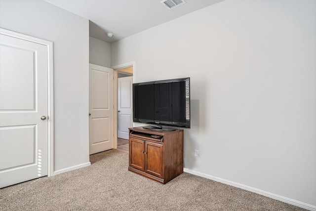 unfurnished bedroom with light carpet, baseboards, and visible vents