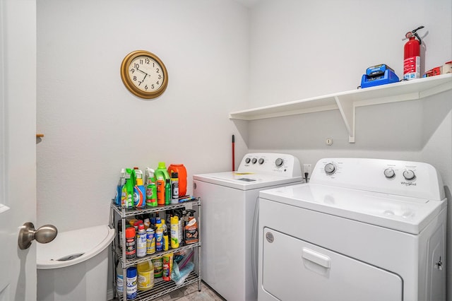 clothes washing area with laundry area and washing machine and clothes dryer