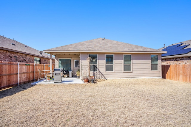 back of house featuring a patio area and a fenced backyard