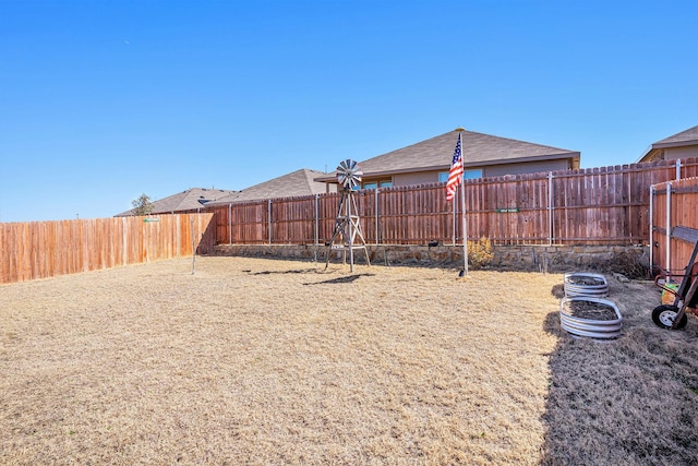 view of yard featuring a fenced backyard