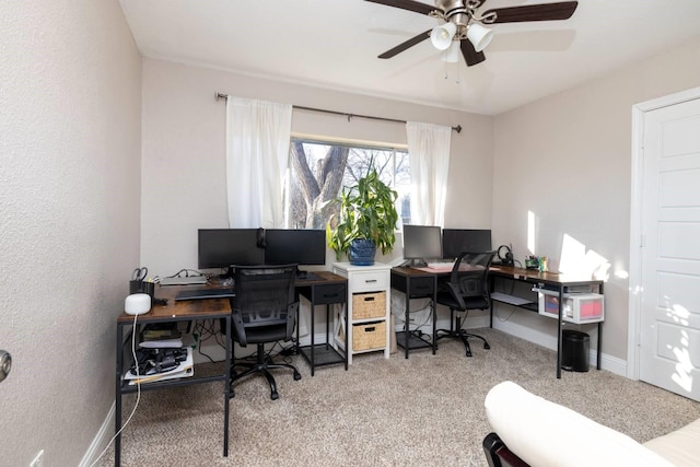 home office with ceiling fan, baseboards, and carpet flooring