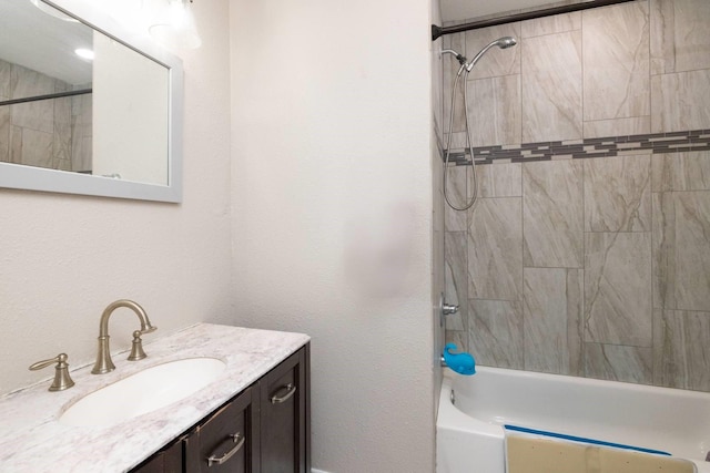 bathroom with tub / shower combination and vanity