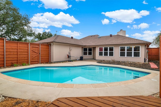 view of swimming pool with a patio, fence, and a fenced in pool