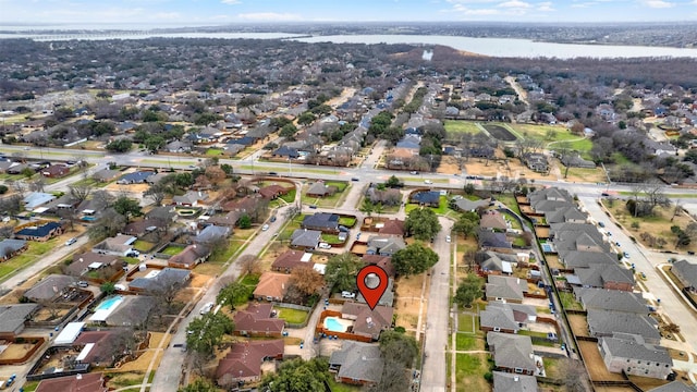 drone / aerial view featuring a water view and a residential view