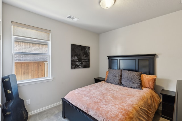 bedroom featuring carpet floors, baseboards, and visible vents