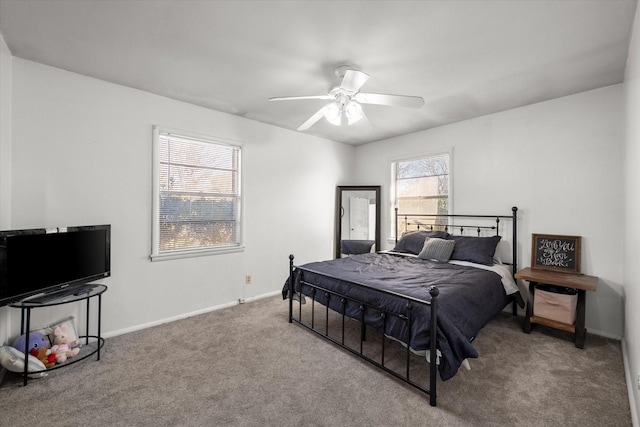 bedroom with ceiling fan, carpet, and baseboards