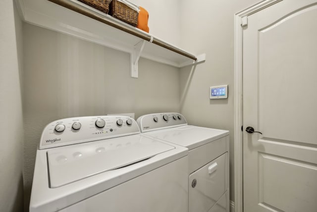 washroom with laundry area and separate washer and dryer