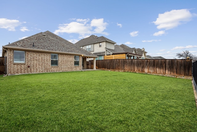 view of yard featuring a fenced backyard