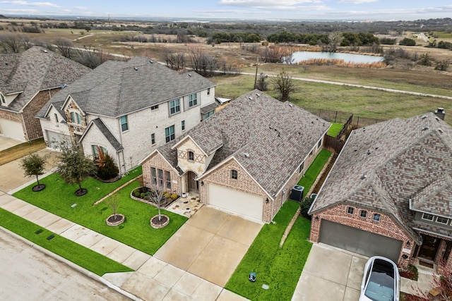 bird's eye view with a water view