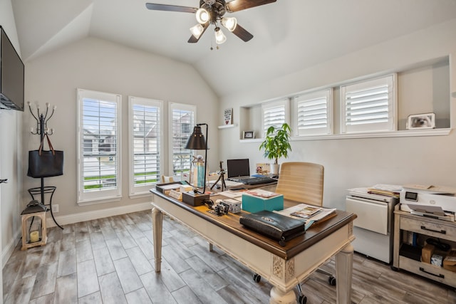 office space featuring ceiling fan, vaulted ceiling, baseboards, and wood finished floors