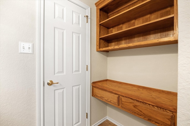 mudroom featuring baseboards