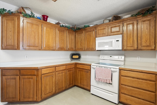 kitchen with brown cabinetry, white appliances, and light countertops