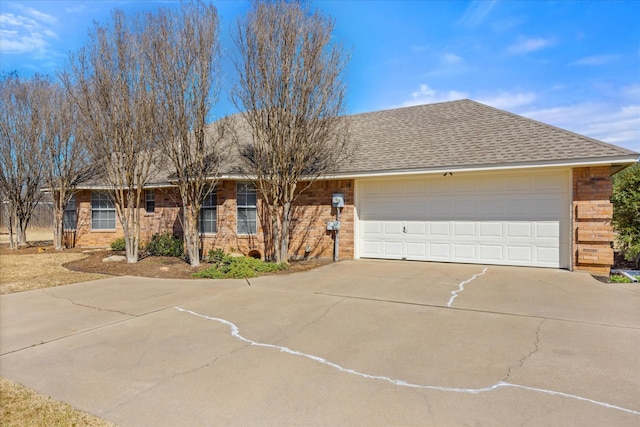 ranch-style home with a garage, concrete driveway, and roof with shingles