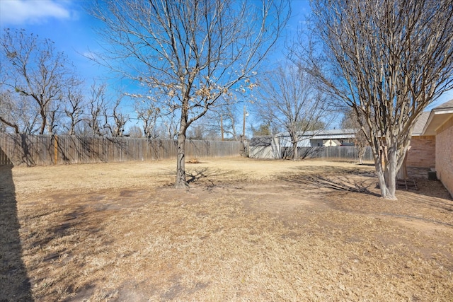 view of yard with a fenced backyard