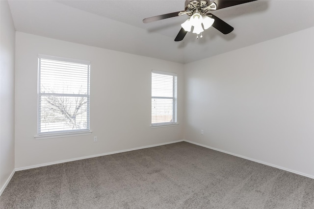 unfurnished room with carpet floors, ceiling fan, and baseboards