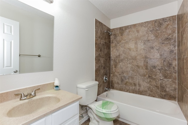 full bath featuring a textured ceiling, shower / washtub combination, vanity, and toilet