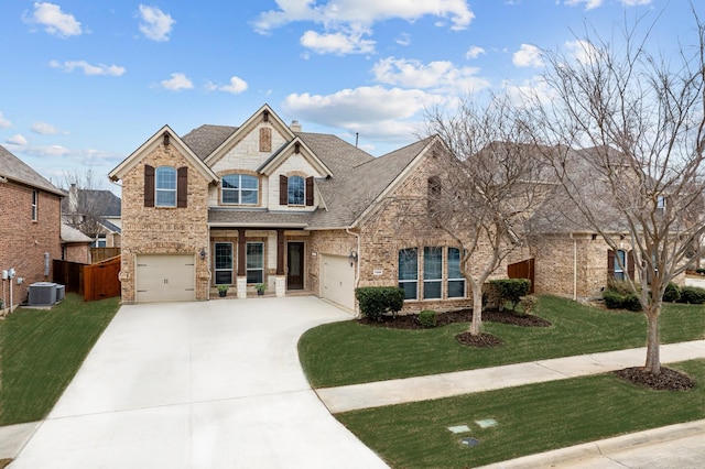 view of front of house with brick siding, a shingled roof, central air condition unit, concrete driveway, and a front yard