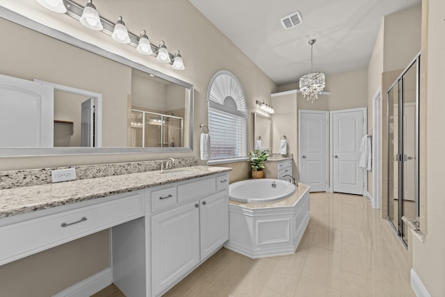 full bathroom with visible vents, a stall shower, an inviting chandelier, a bath, and vanity