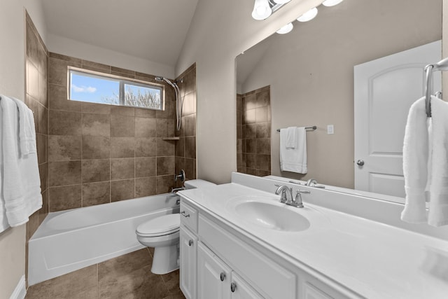 full bath with tile patterned floors, toilet, lofted ceiling, bathtub / shower combination, and vanity