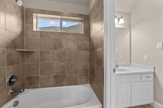 bathroom featuring vanity and  shower combination