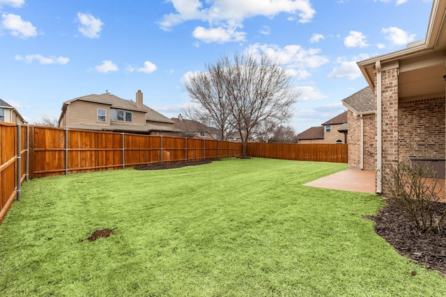 view of yard featuring a patio and a fenced backyard