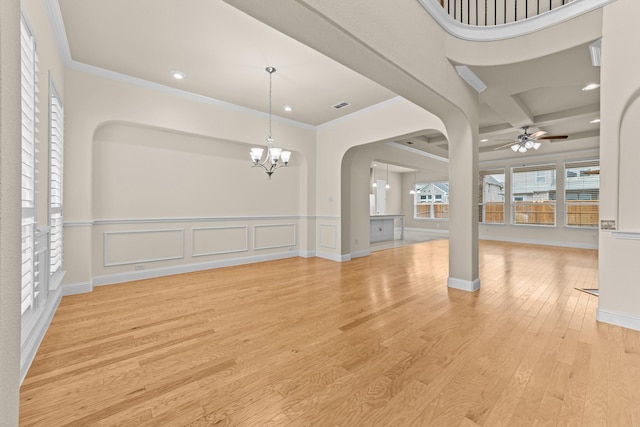 interior space featuring crown molding, light wood-style flooring, ceiling fan with notable chandelier, and visible vents