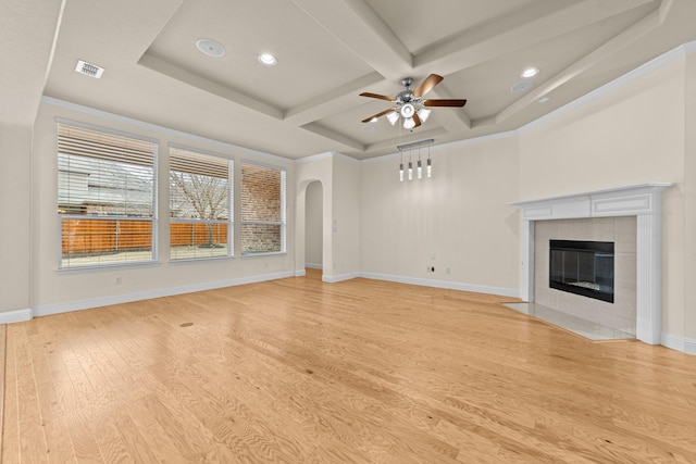 unfurnished living room featuring visible vents, coffered ceiling, light wood-style floors, baseboards, and ceiling fan