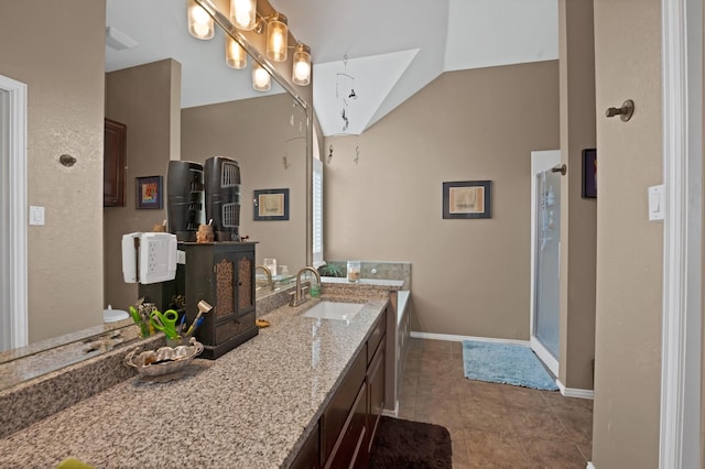 bathroom with baseboards, lofted ceiling, tile patterned floors, vanity, and a shower stall