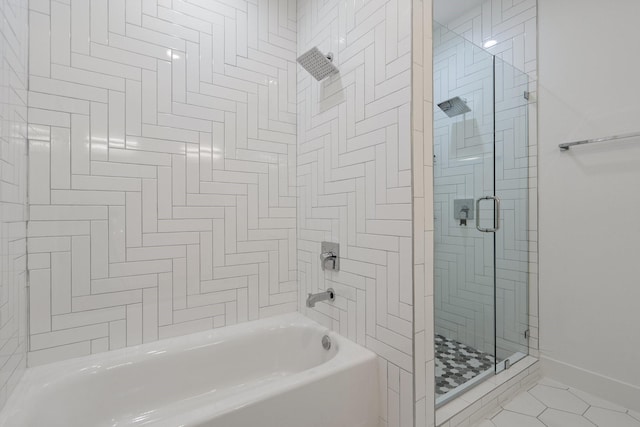 bathroom with baseboards and tile patterned floors