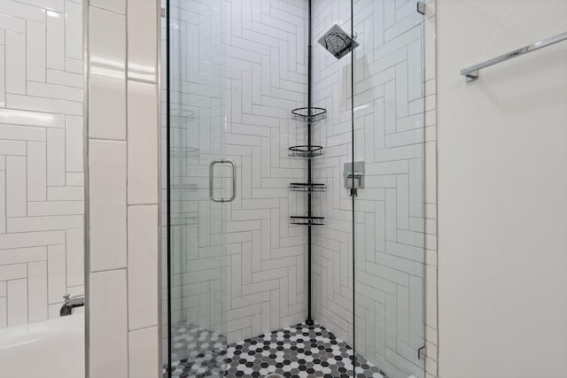 full bath featuring a shower stall