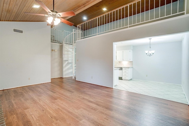 unfurnished living room with stairway, wood ceiling, visible vents, and light wood finished floors