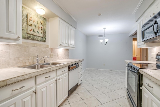 kitchen with crown molding, light countertops, backsplash, a sink, and black appliances