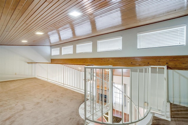 hallway with wooden ceiling and carpet