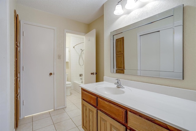 full bathroom with bathing tub / shower combination, toilet, tile patterned floors, a textured ceiling, and vanity