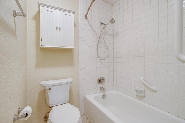 bathroom with toilet and washtub / shower combination