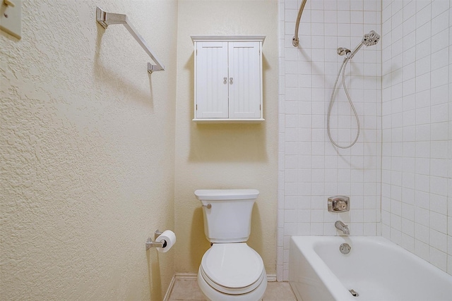 full bathroom featuring baseboards, tub / shower combination, a textured wall, and toilet