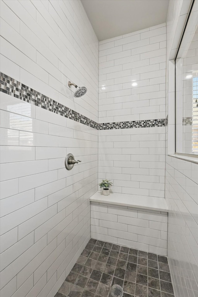 bathroom with tiled shower