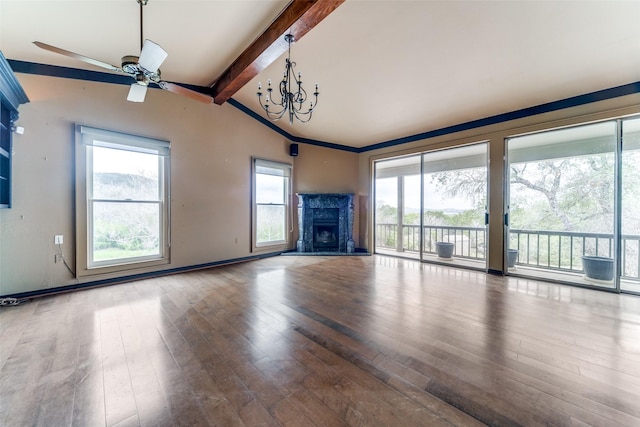 unfurnished living room with lofted ceiling with beams, a fireplace, baseboards, and wood finished floors