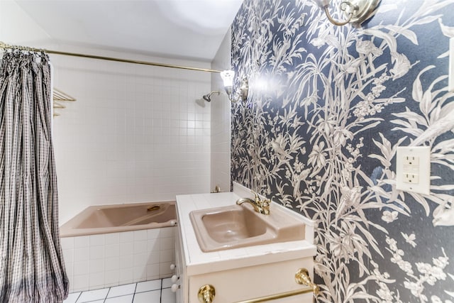 bathroom featuring shower / bath combo with shower curtain, vanity, and tile patterned floors