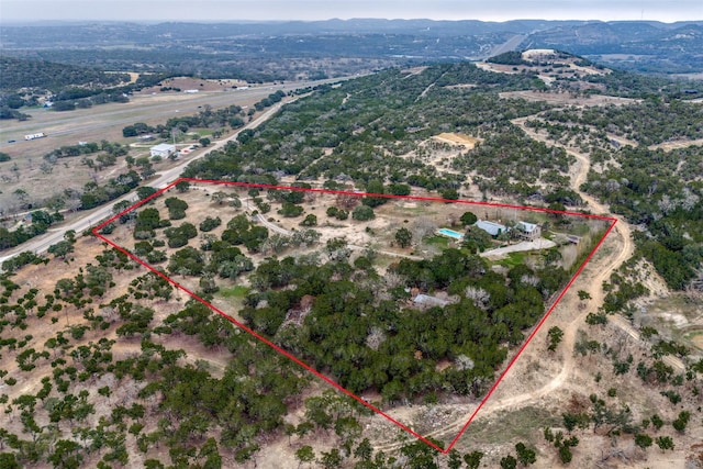 birds eye view of property featuring a rural view and a mountain view