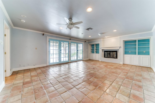 unfurnished living room with crown molding, recessed lighting, visible vents, a glass covered fireplace, and baseboards