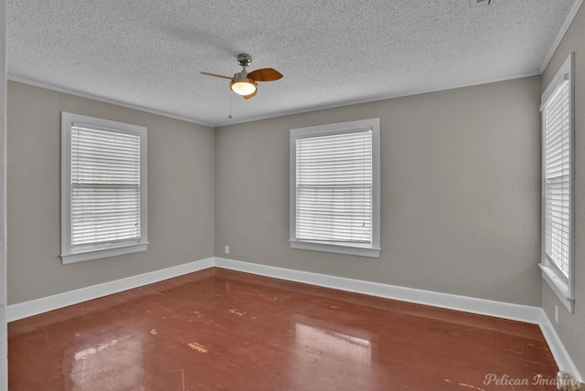 spare room with a healthy amount of sunlight, baseboards, and a ceiling fan