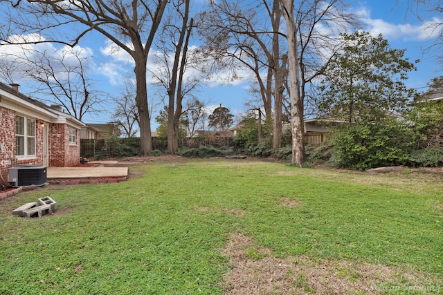 view of yard featuring central air condition unit and a fenced backyard