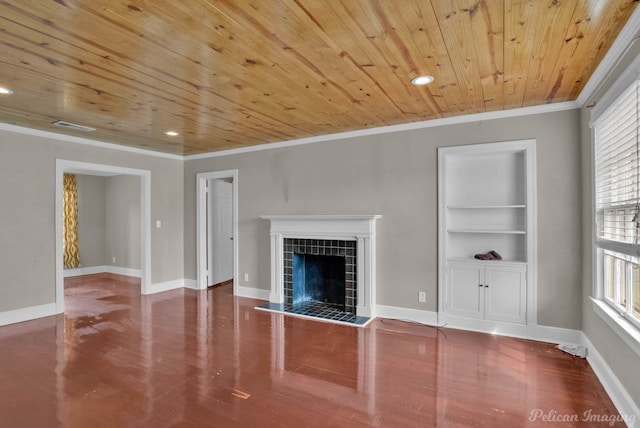 unfurnished living room with built in features, crown molding, a fireplace, wooden ceiling, and baseboards