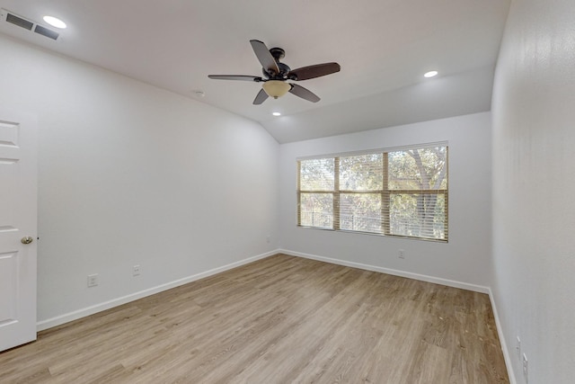 empty room featuring lofted ceiling, recessed lighting, visible vents, light wood-style floors, and baseboards