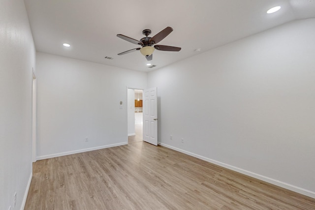 spare room with recessed lighting, visible vents, light wood-style flooring, ceiling fan, and baseboards