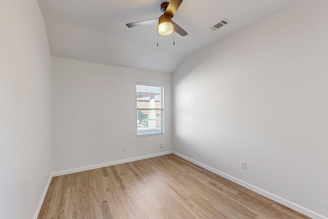 empty room with light wood-type flooring, baseboards, visible vents, and a ceiling fan